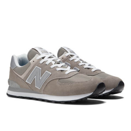 Stylish grey and white New Balance 574 sneakers, perfect for any casual outfit. New Balance ML574EVG