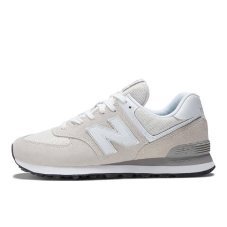 Stay on-trend with these beige New Balance 574 trainers. New Balance ML574EVG.