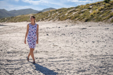 Model wearing Columbia Chill River dress on the beach