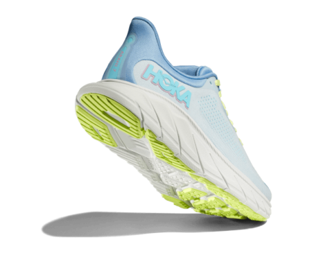 The Hoka Arahi light blue runners with cirton green laces and midsole.
