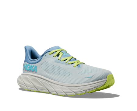 The Hoka Arahi light blue runners with cirton green laces and midsole.