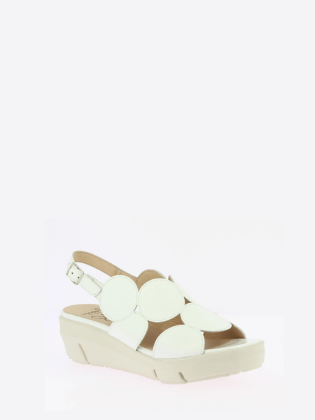 White Patent sling back wedge sandal with cutouts on a white base.