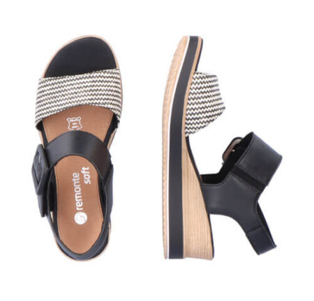 A stylish Remonte Siradia wedge sandal in classic black and white, featuring a chic buckle for added flair.