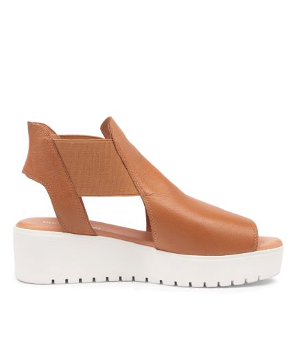 Slip on Tan Ozie sandal with white base by Django and Juliette