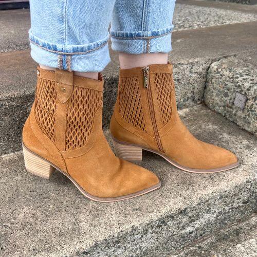 Model wearing suede carmela cowboy boots