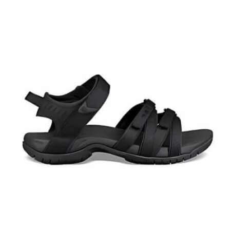 A Teva Tirra sandal in black, featuring multiple adjustable straps for a secure fit. The sandal has a contoured footbed and a rugged, non-slip sole, designed for comfort and stability during outdoor activities. Ideal for hiking or everyday adventures.