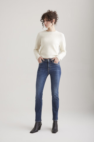 Model wearing Cup of Joe Hannah Straight leg denim in a dark blue wash