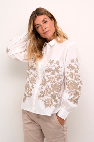 Model wearing the Cream CRDaisy blouse in white with taupe floral embroidery.