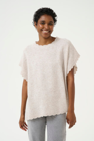 Model wearing the Cream CRDammi poncho