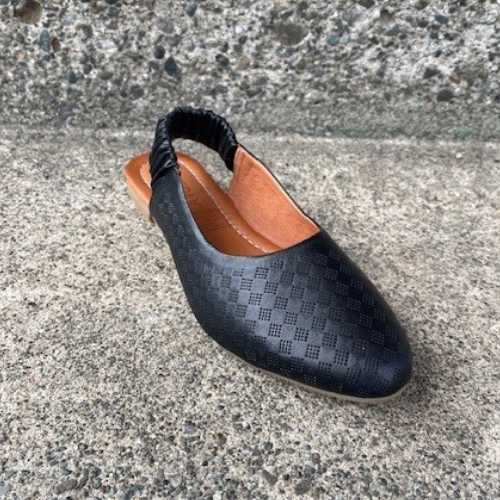 Everly Nora slingback on a concrete step